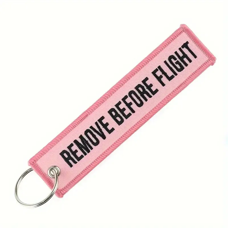 Remove Before Flight Pink Keychain